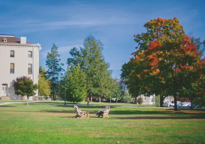 A student sits in a chair on Musselman Beach.