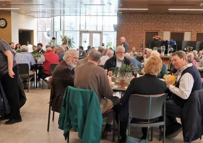 Patrons eat at the Atrium in the campus dining hall.