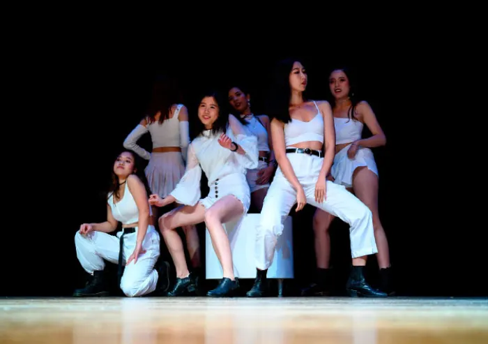 A group of students performing a dance routine.