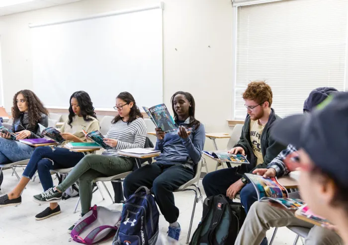 Students sit in a classroom.
