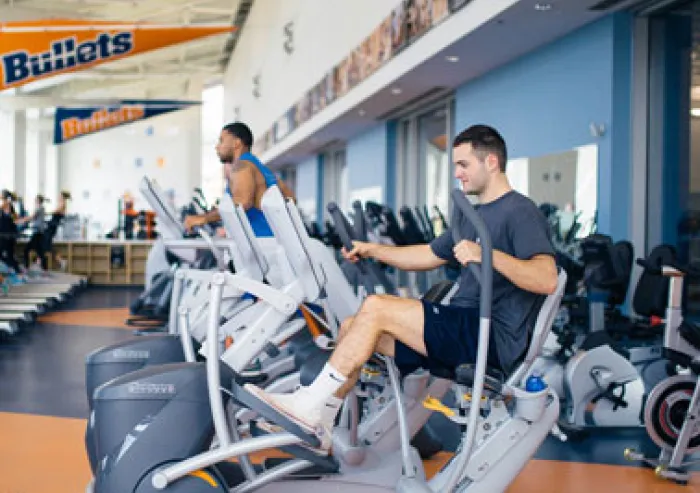 Students work out in the fitness center.