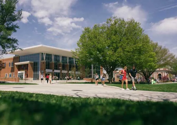 Students walk outside the John F. Jaeger Center for Athletics, Recreation and Fitness.