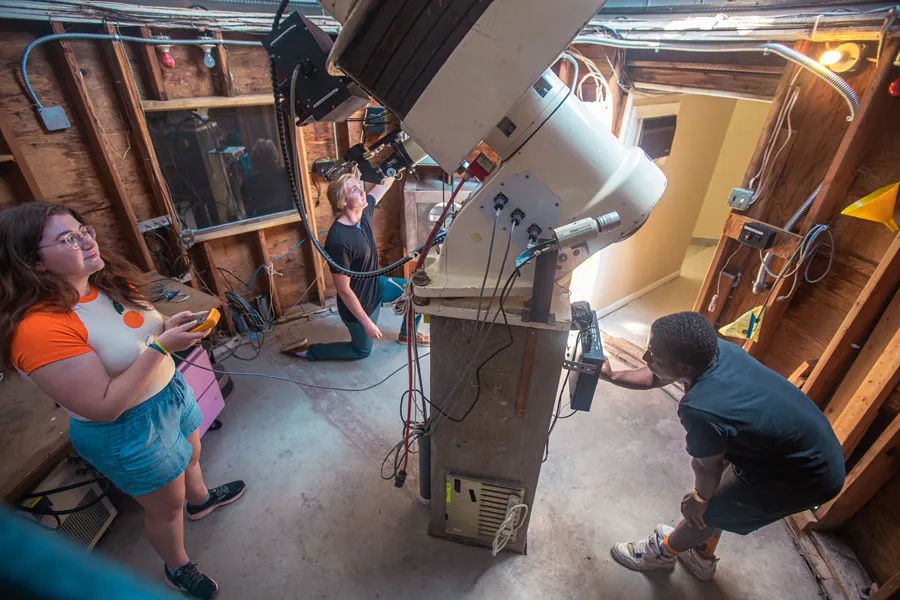 X-sig students with a telescope