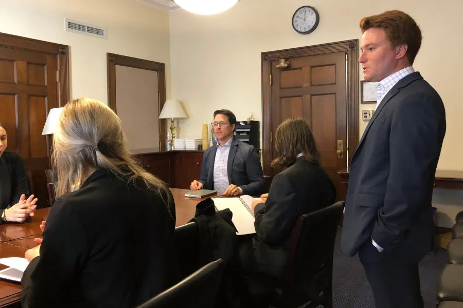 group speaks at business meeting
