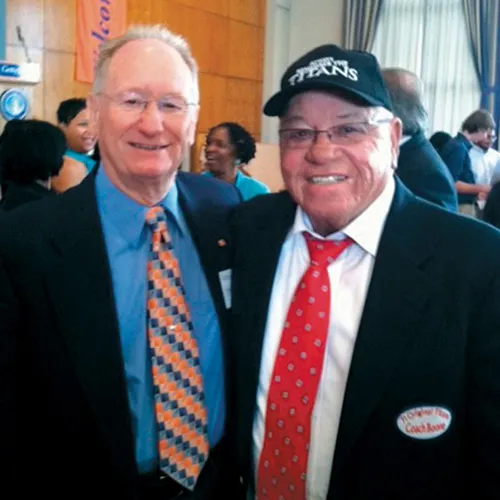 Gareth V. “Lefty” Biser ’57 with T.C. Williams coach Herman Boone