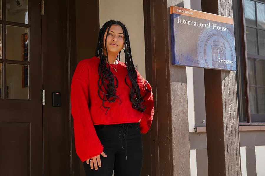 Meriem stands in front of International House