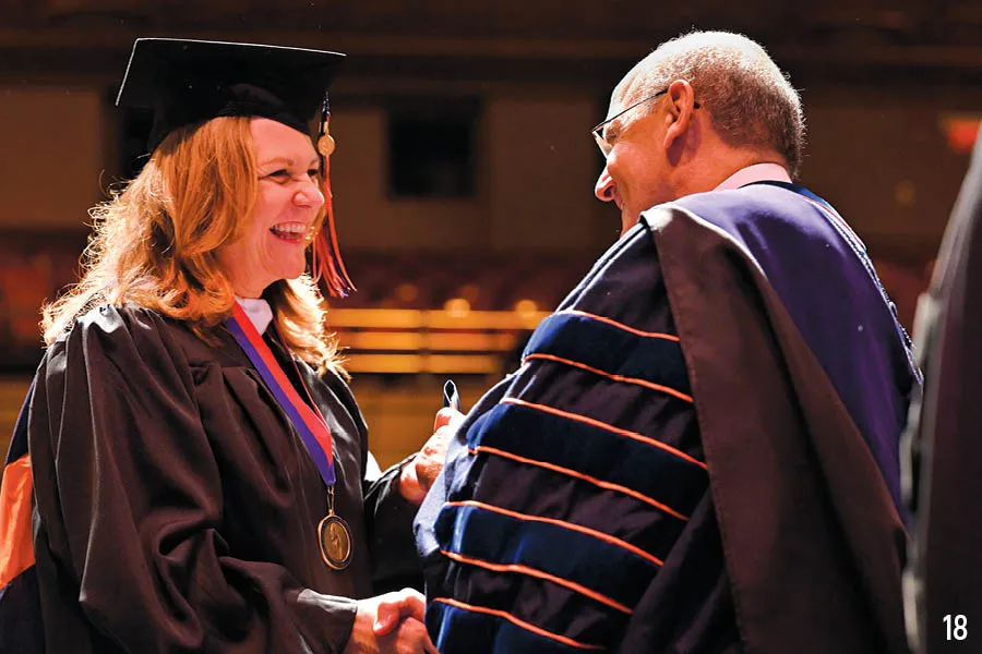 President Iuliano congratulates female Masters grad