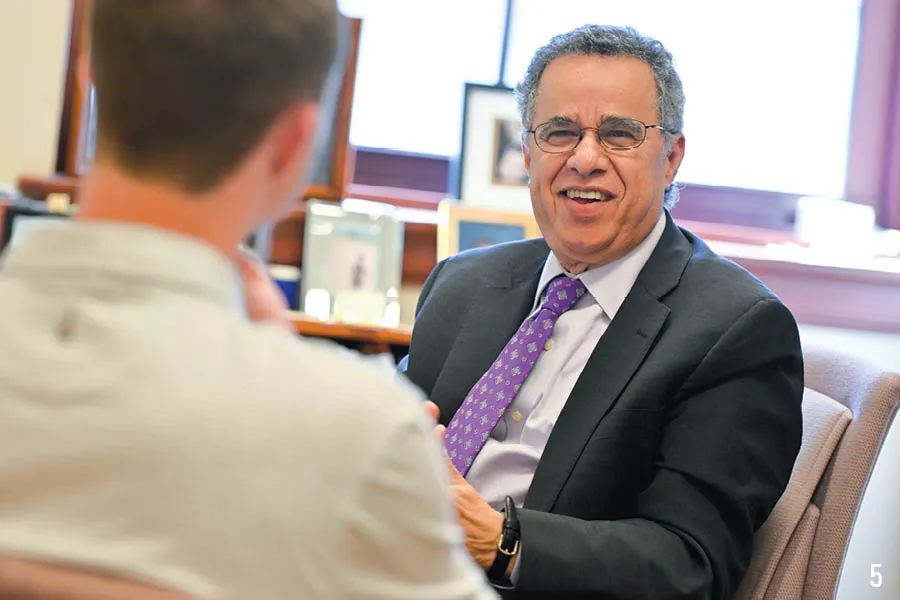 prof smiles at someone in foreground