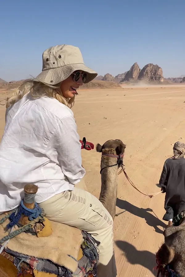 Giovanna Komst rides atop a camel