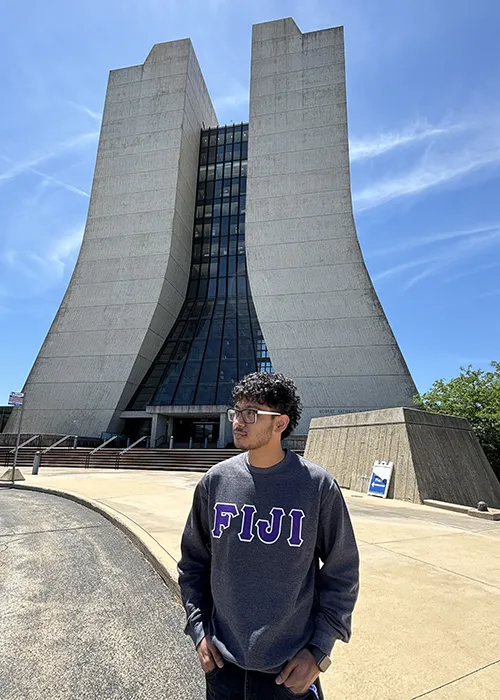 Yaman Acharya takes a photo outside Wilson Hall