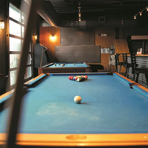 The Attic features two pool tables and a Skee-Ball machine