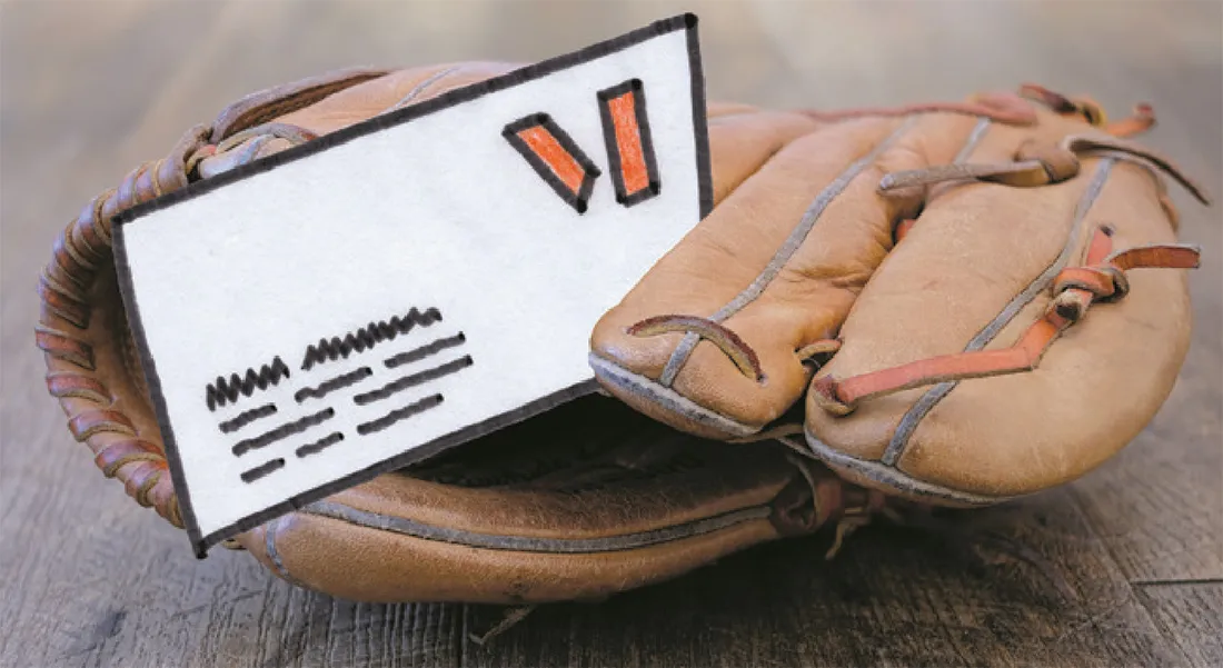 A baseball glove with an envelope tucked inside