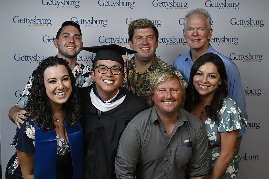 A photo of a Graduate with family and friends