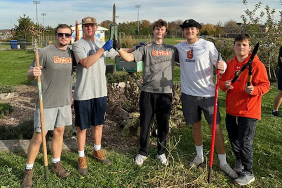  Gettysburg College Men’s Lacrosse team working at the Painted Turtle Farm