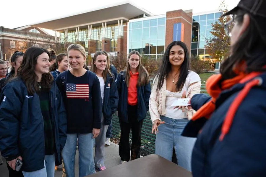 A photo of students receiving their table numbers