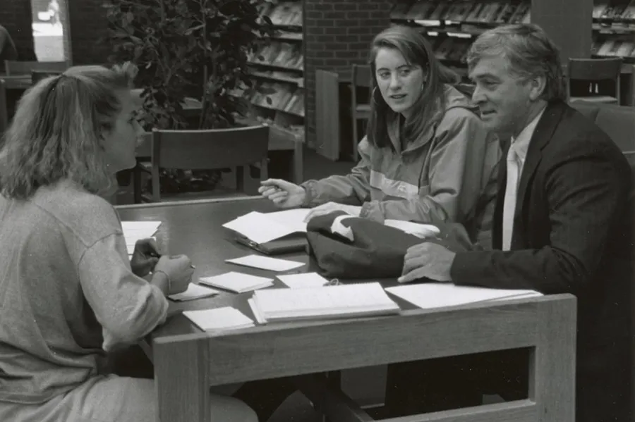 President Gordon Haaland at the library with students