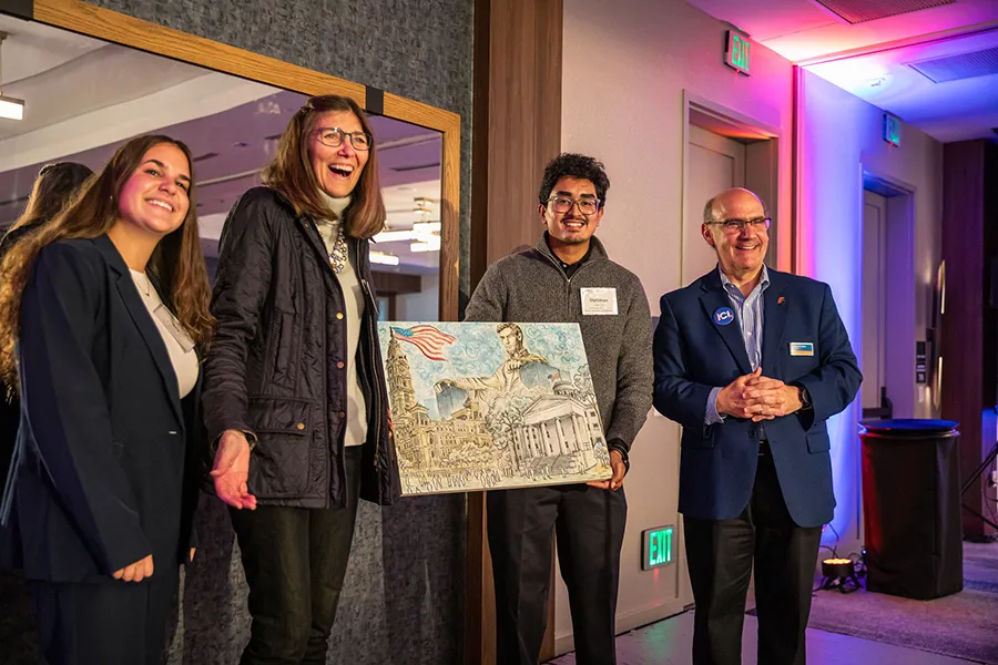 Ava Burchell ’25 with Janette Guarisco Scott ’77, Diptiman Das ’27, and President Iuliano.