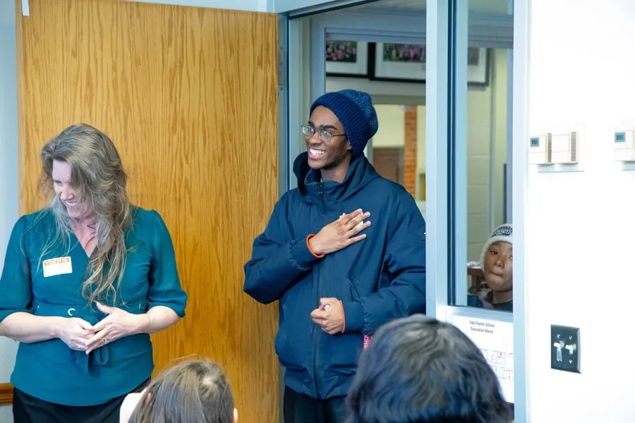 Mason McFarland ’27 is surprised by representatives from Big Brothers Big Sisters at Vida Charter School.