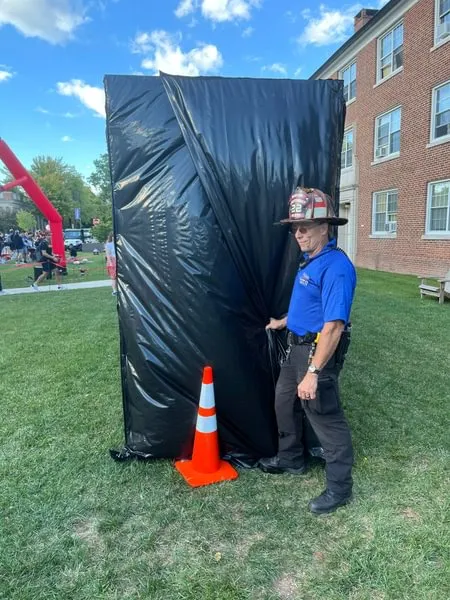  Officer Tom Ahlers teaches students about fire safety.