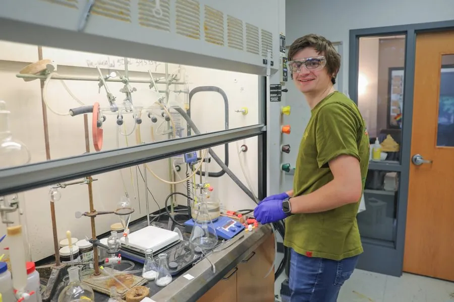 Max Alves ’26 conducts lab research with Prof. Timothy Funk during summer 2025.