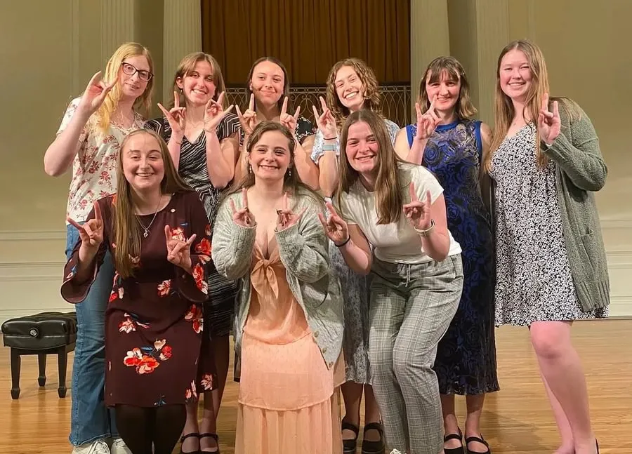 Green with fellow members of the Epsilon Beta chapter of Sigma Alpha Iota following the Songs of Support Benefit Recital in spring 2025.