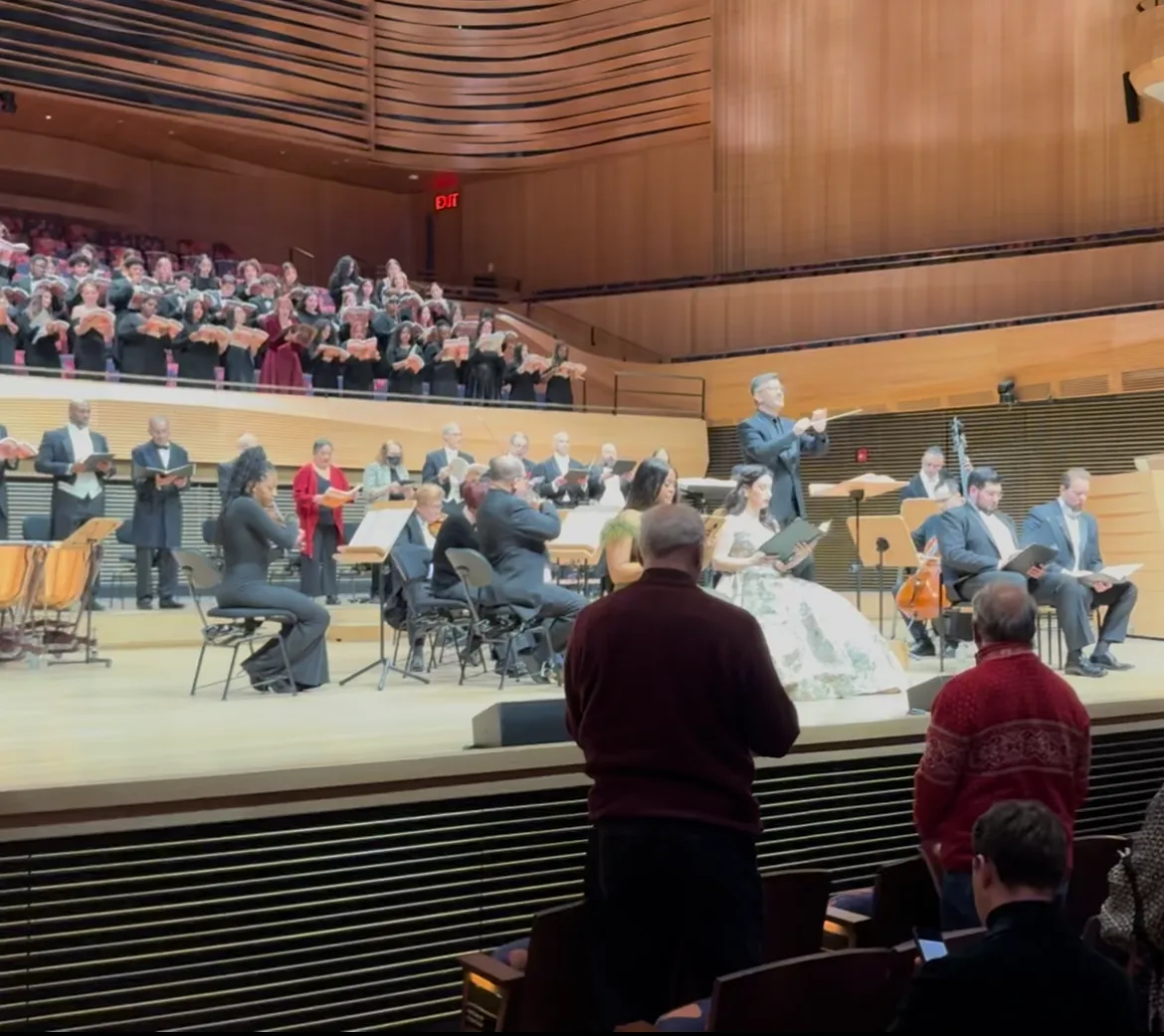conductor and singers on stage