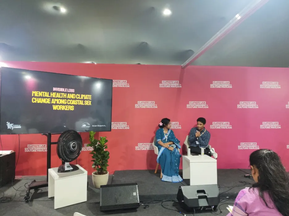 young people conduct interview in front of large screen