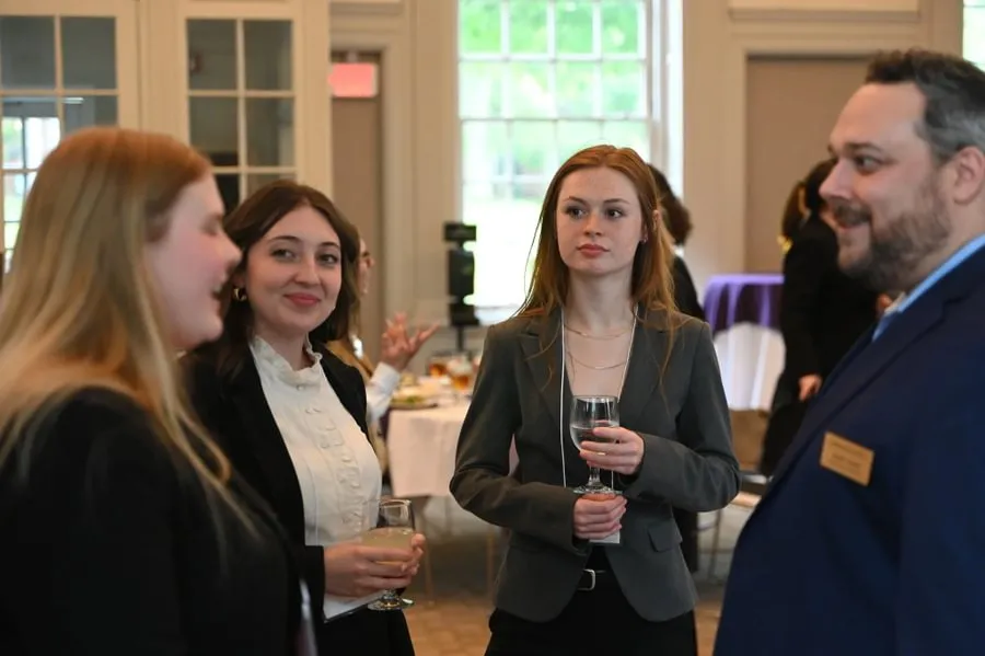  Nora Hafford ’28 (center) listens to a discussion during a networking session at the NEW Leadership Pennsylvania summer institute during the summer of 2025.