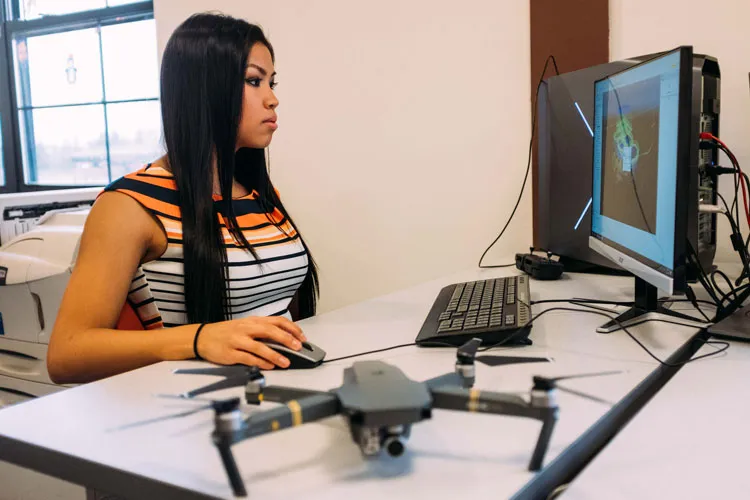 female student works at computer