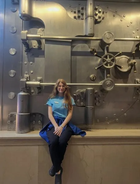 Colleen Bergmann ’25 standing in front of a bank vault at the Milken Center in Washington, D.C.