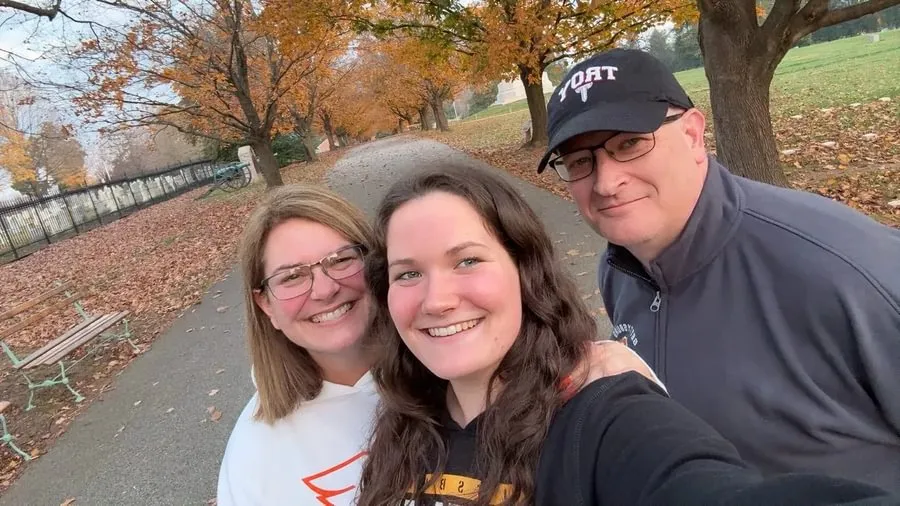 Jenn P’29, Kara ’29, and Scott Woods P’29 snap a photo at Gettysburg National Cemetery in fall 2025.