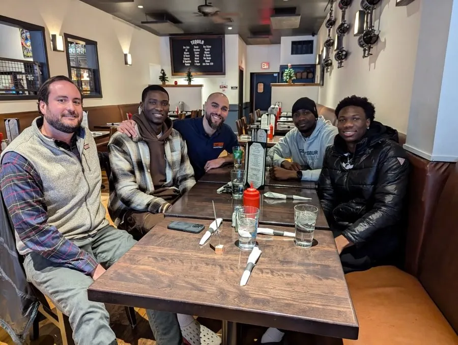 Kevin Kennedy ’11 and Jack Kern ’09 connecting with men’s basketball alumni to support student-athletes.