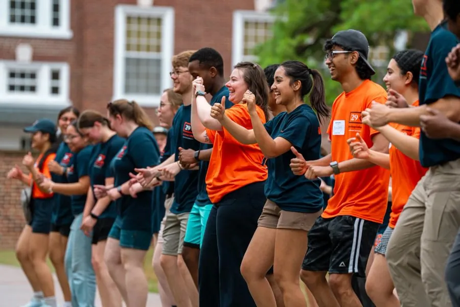 Bishruti Rijal ’26 (second from center) joins fellow student staff members from Residence Life to greet first-year students on Move-In Day.