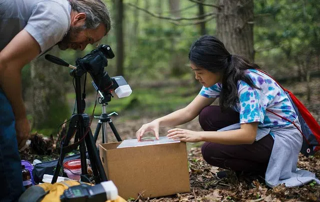 A Gettysburg College student and faculty member working together outdoors on field research.