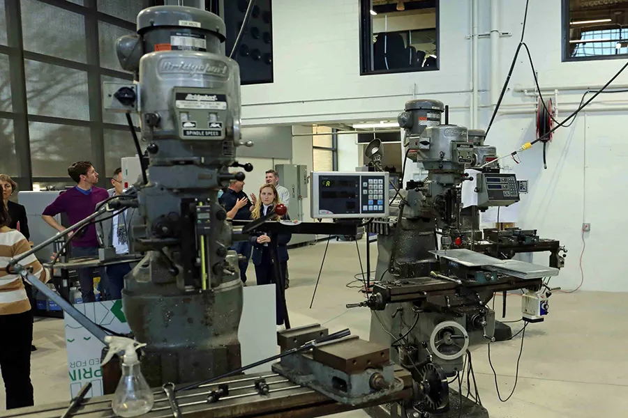People in front of a machine