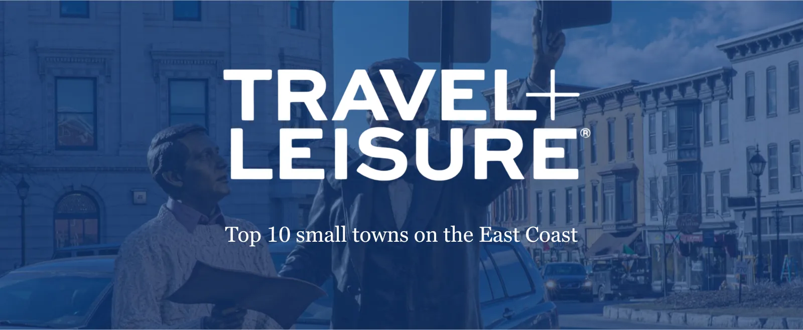 The Travel + Leisure logo over a background image of a statue of Abraham Lincoln.