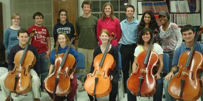 Gettysburg College students pose with cellos.