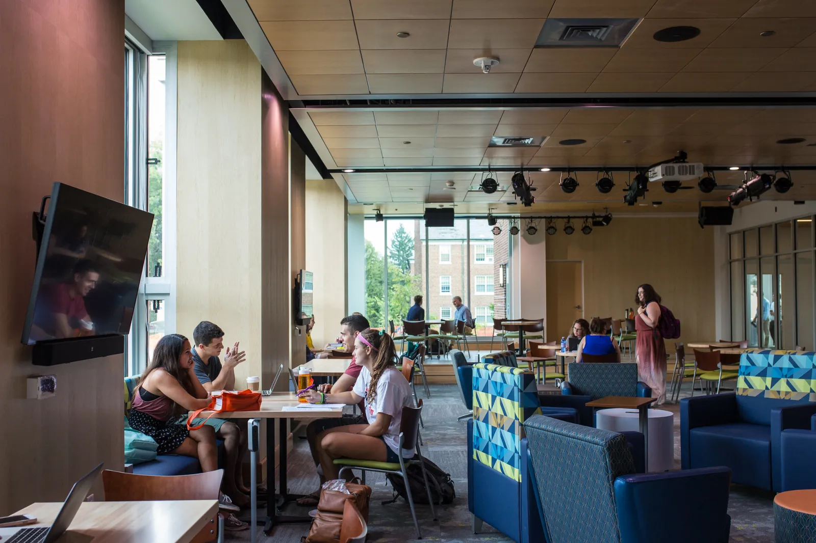 Students sitting in the Junction right outside of the Commons Marketplace