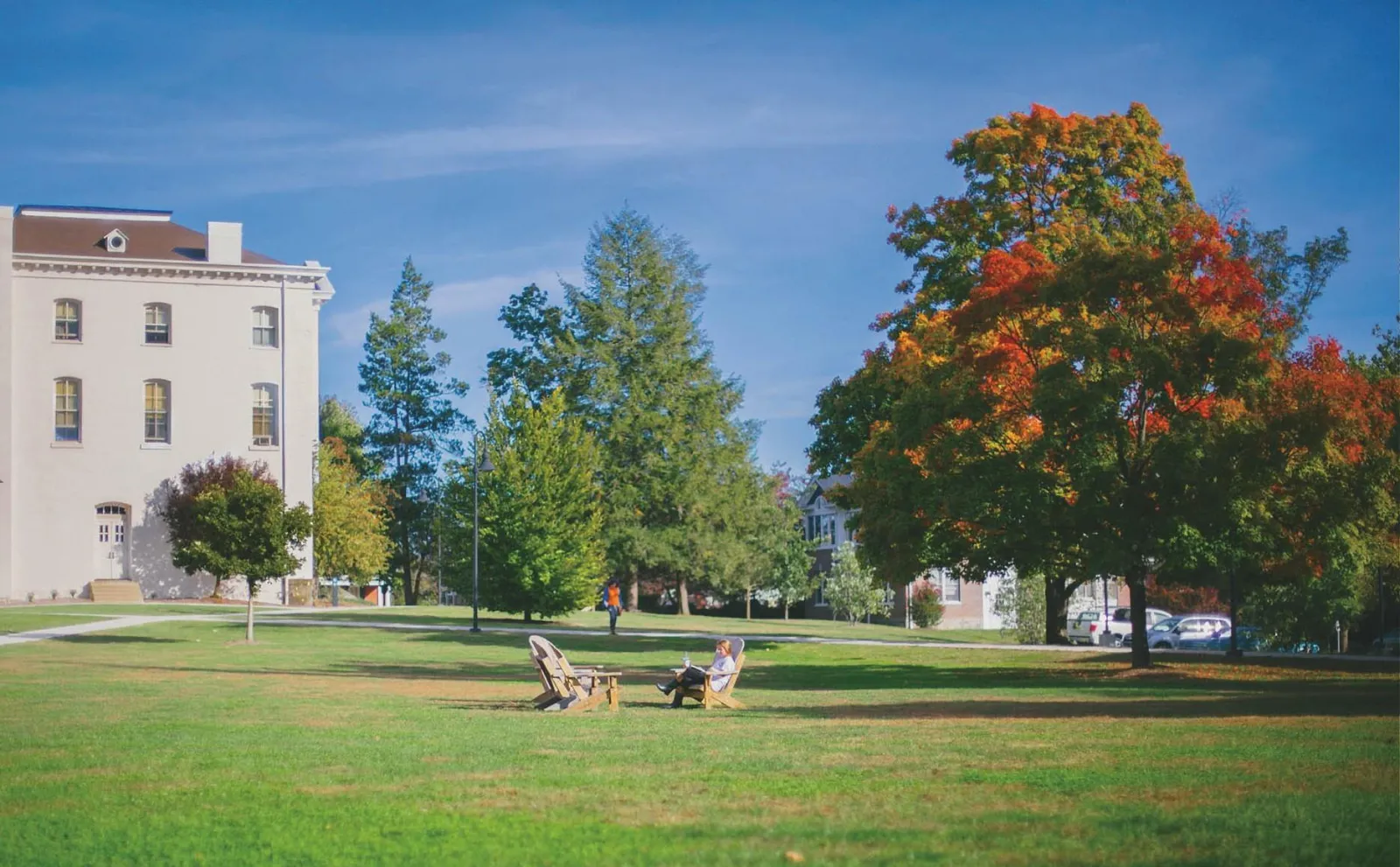 A student sits in a chair on Musselman Beach.