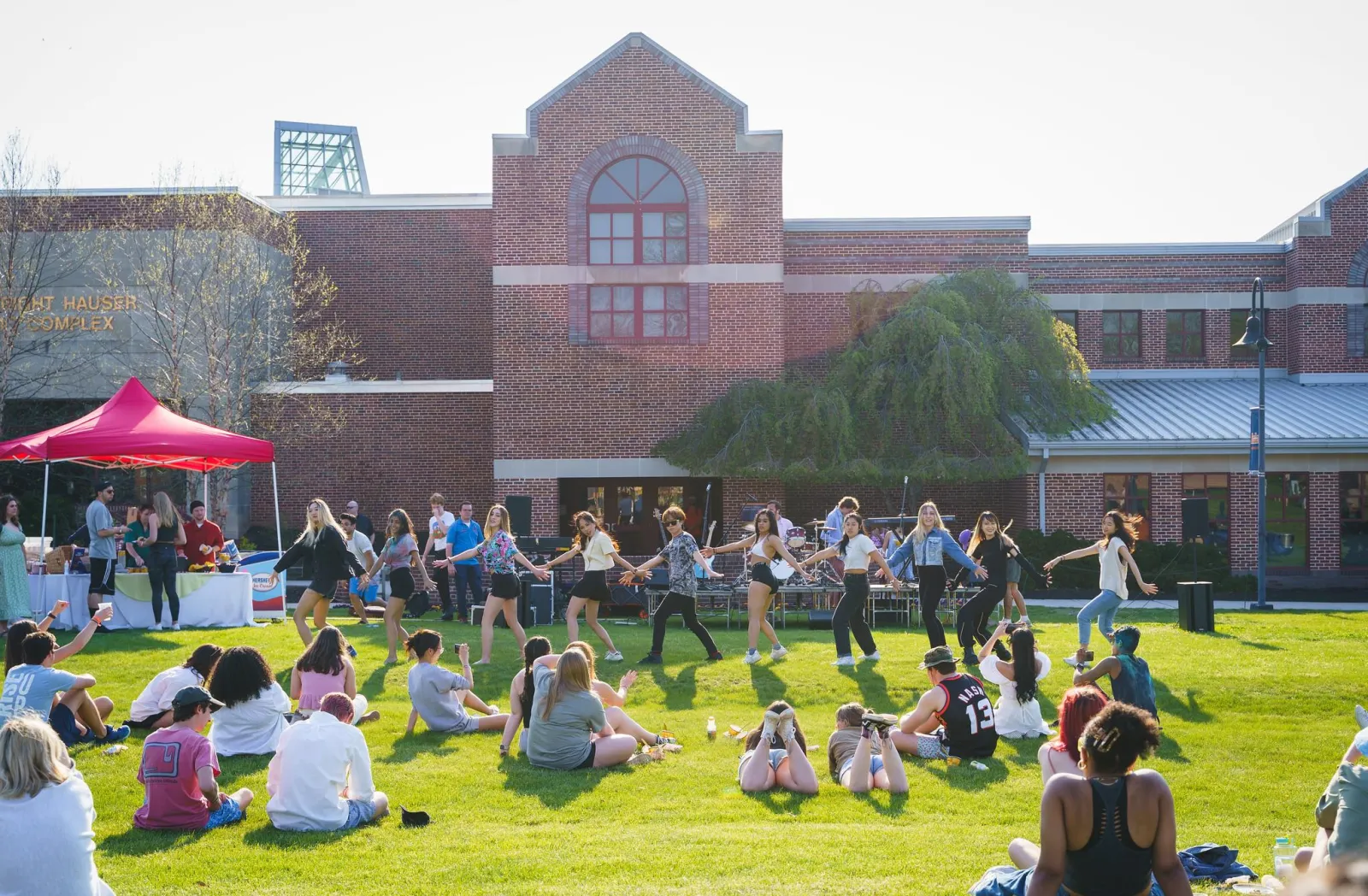 Students watch an event at Servo Field.