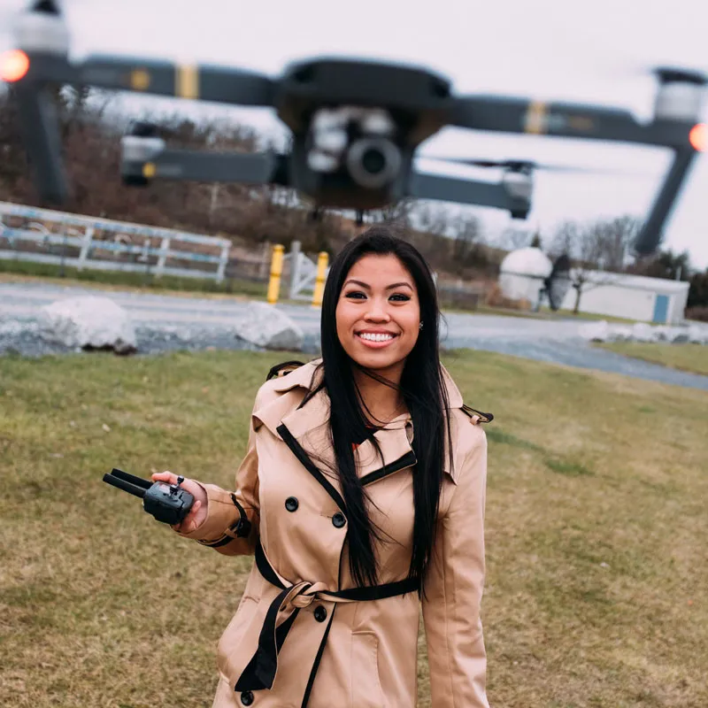 A woman performs research with a drone.
