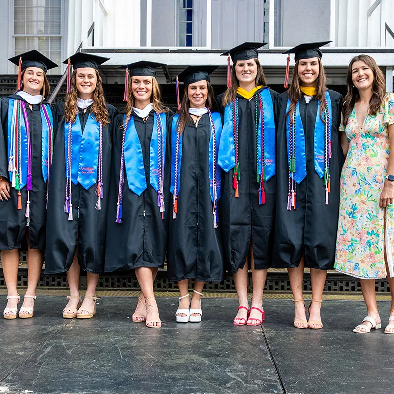 A group of graduates pose for a picture