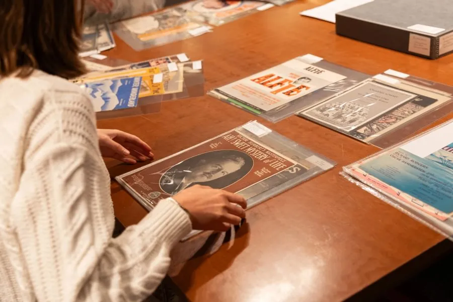 Zee Dawson ’29 examines a music score for Victor Herbert’s “Ah! Sweet Mystery of Life.”