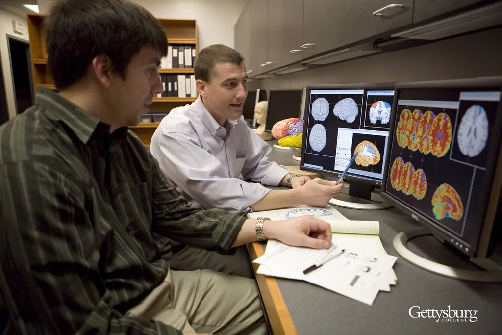 prof and student review computer brain scans