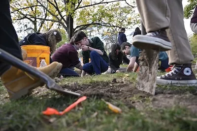 students working on excavation