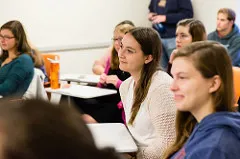 Students listen attentively during a classroom discussion.
