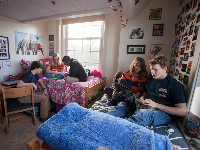 A group of students in a dorm room.