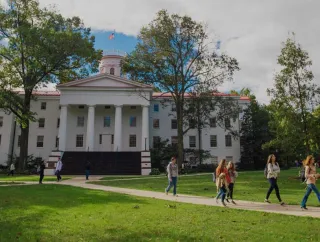 Gettysburg College campus with students walking near Pennsylvania Hall.