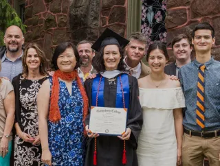 A group image of a graduate with family and friends.
