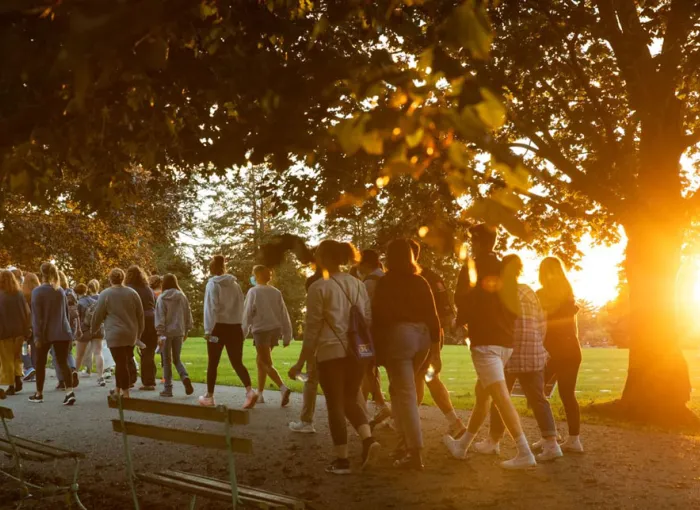 Students walk down a path during the First-Year Walk.
